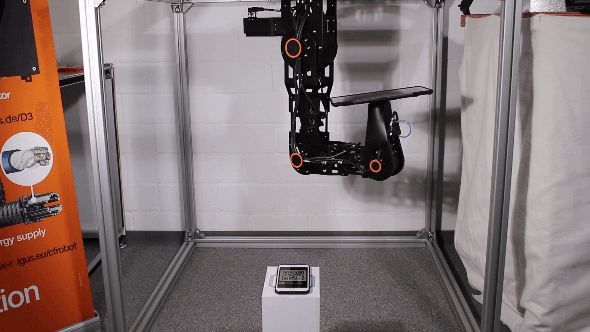 Robot mounted overhead scans QR code